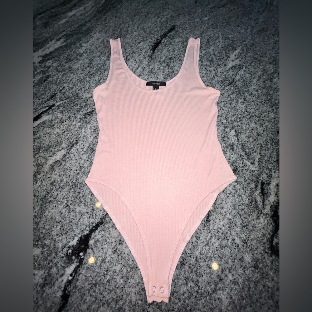 Baby pink body suit